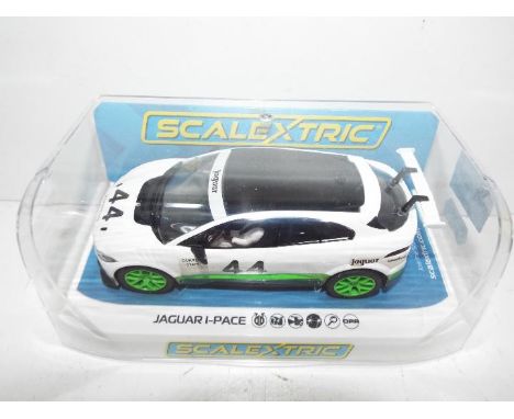 Scalextric - Slot Car in 1:32 scale. # C4064 Jaguar I-Pace. Vehicle appears mint in perspex presentation case. Slight storage