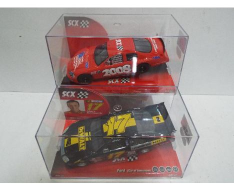 SCX - 2 x Slot Cars in 1:32 scale. # 63390 Ford Nascar Kenseth and # 63430 Chevrolet Monte Carlo. Vehicles appear mint in per