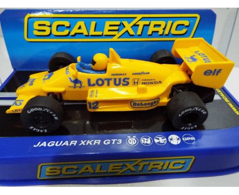 Scalextric - Slot Car model in 1:32 Scale - Formula Lotus. Incorrect box. Appears mint in presentation case. Light storage we