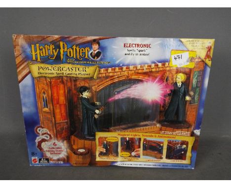 A Harry Potter And The Philosopher's Stone Powercaster electronic spell-casting playset by Mattel, in original factory sealed