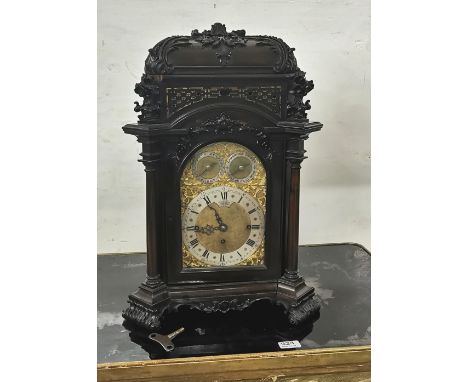 Late 19thC Bracket Clock, in a Gothic Revival Case on scrolled feet, with Cambridge Chimes on 8 bells, the silvered dial stam