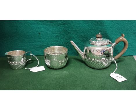 Three Piece London Silver Victorian Tea Service of small proportions, comprising of a Teapot, sugar bowl and cream jug, dated