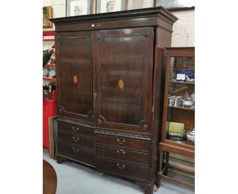 Georgian Mahogany Wardrobe, moulded cornicing above two front doors featuring oval inlaid panels and faux sets of drawer hand