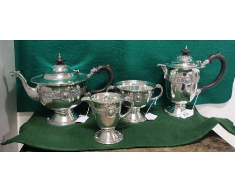 Four Piece Irish Silver Tea Service comprising of a Tea Pot and Hot Water Pot on stem bases, with a Sugar Bowl and Cream Jug,