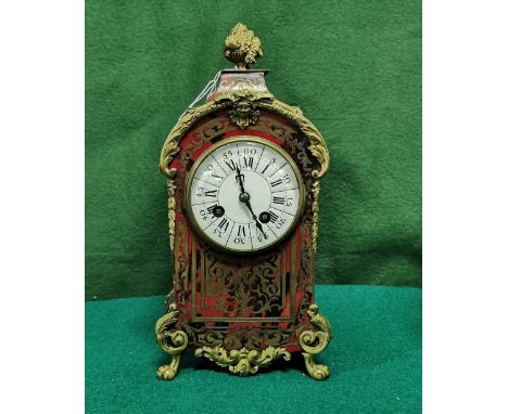 Early 20thC French Mantle Clock, with small gilt floral basket over a red tortoiseshell style case, roman numerals to the whi