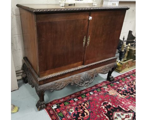 Georgian Mahogany Blanket Chest, with a rope-edged top, above two doors enclosing a shelf, on a highly carved base, on 4 hair