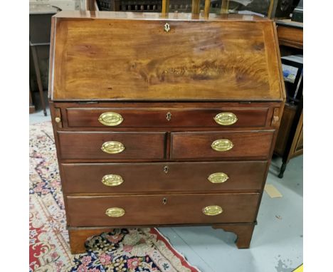 Georgian Mahogany Bureau, the fall front opening to an arrangement of drawers and compartments, over 5 drawers with brass eag