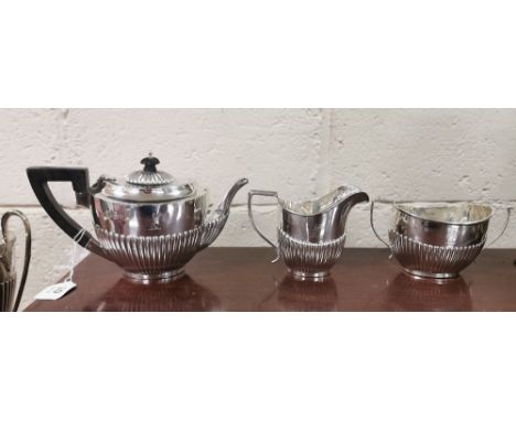 Three Piece Birmingham Silver Tea Set, hallmarked 1904, consisting of a Teapot (13cmW x 23cmH), a sugar bowl and a cream jug,