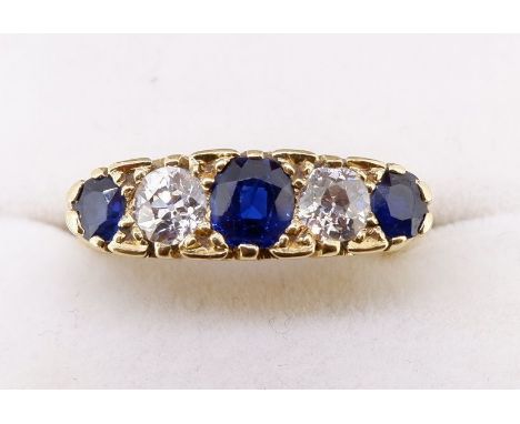 An 18 carat gold sapphire and diamond ring, size Q-R 