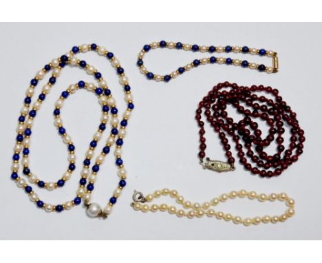 A garnet bead necklace, pearl and lapis lazuli necklace and bracelet and a pearl bracelet 