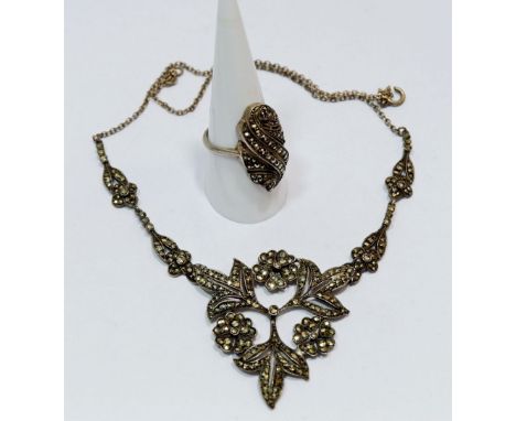 A silver marcasite necklace and similar ring 
