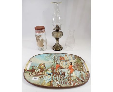A vintage tray printed hunting scene, a vintage Nip-A-Kofs sweet jar and an oil lamp with glass frill top funnel 