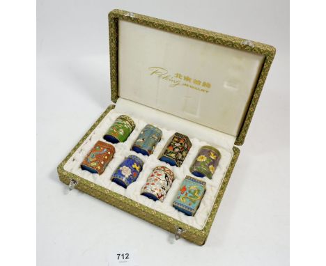 A boxed set of Chinese cloisonne enamel miniature tea caddies