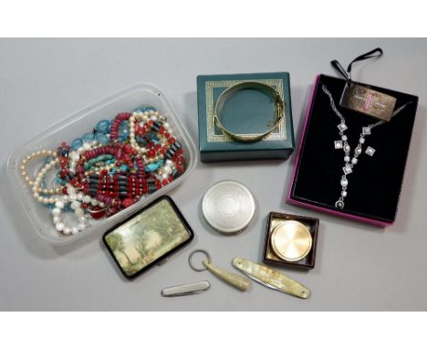 A box of costume jewellery, Dhaussy compact, a cigarette case etc. 