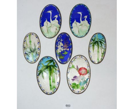 Seven oval Japanese Qibao Shou enamel plaque decorated flowers and birds, larger panels 14 x 8.5cm