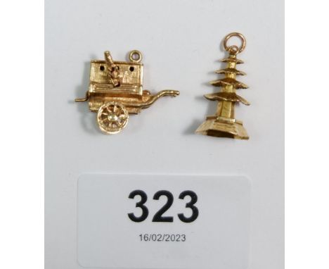 Two gold charms in the form of an organ grinder and a pagoda, 5.2g, unmarked but tested as gold 