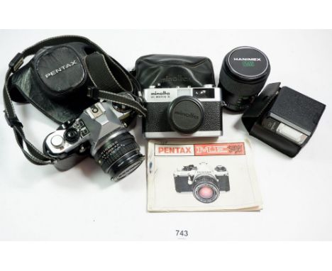 A Pentax ME super camera and Hanimex lens plus a Minolta camera and flash 