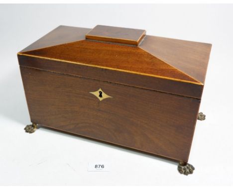 A 19th century mahogany tea caddy with paw feet and fitted two caddies, 30cm wide 