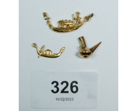 Two gold gondola charms and a charm of an oil lamp, 5.5g, unmarked but tested as gold 