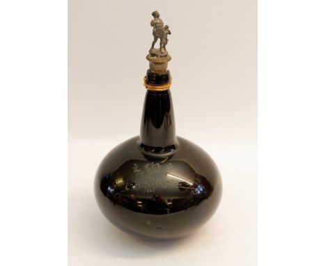A 19th shaft and globe glass bottle engraved crown over 'Cm Mt Mitchell 1847' with pewter stopper, bottle has chip to rim 