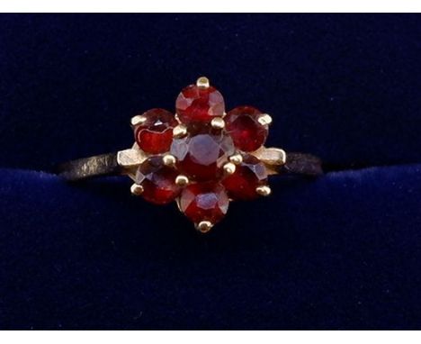 A 9 carat gold garnet cluster ring, size K 