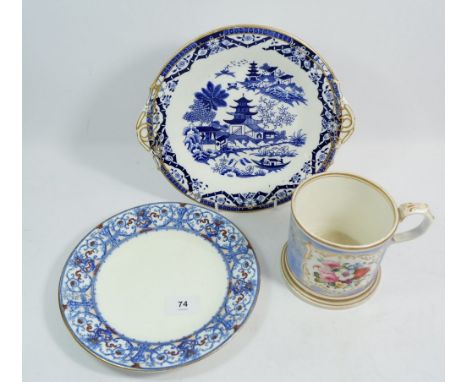 A Victorian porcelain large mug painted flowers on a blue ground (cracked to base) a Graingers Worcester cake plate and a Dou