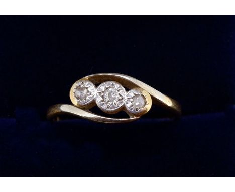 An 18 carat gold and platinum illusion set three stone diamond ring, size K to L, 1.9g