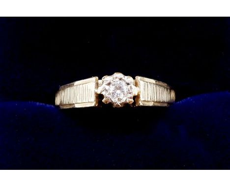 A 9 carat gold vintage solitaire diamond ring with textured shoulders, size I, 2g
