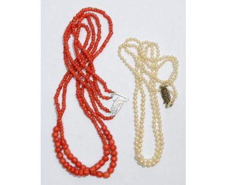 A 1930's coral necklace with silver clasp and a seed pearl necklace 