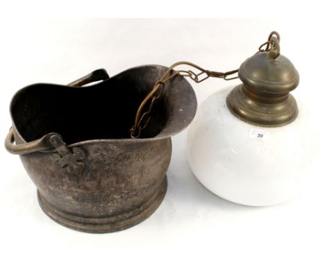 A brass coal helmet, glass ceiling lamp plus a wool rug