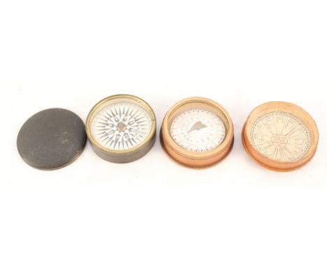 A 19th Century treen magnetic indicator and compass plus a brass cased compass