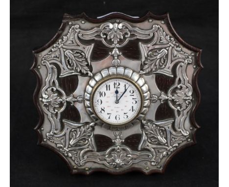 A Portuguese mantel clock with white metal leaf cladding, marked Leitao Irmao, Lisboa