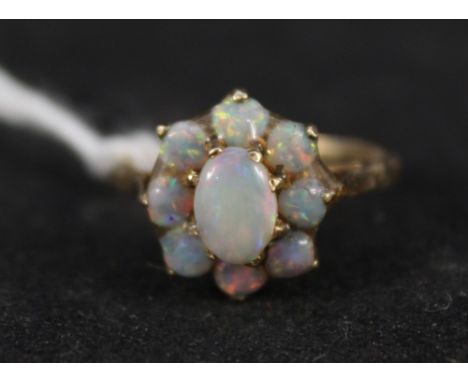 A 9ct gold opal cluster ring, size M