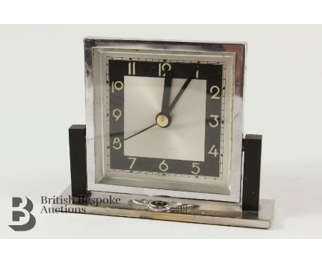 Bentley desk clock. The clock having a silvered face with numeric dial, by Kienzle, approx 11 x 13.5 cms. -