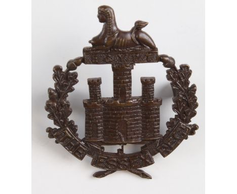 Essex Regt., small early Officer bronze Hat badge stamped J.R.Gaunt, London, on the reverse and has 2 crumpled fold over lugs