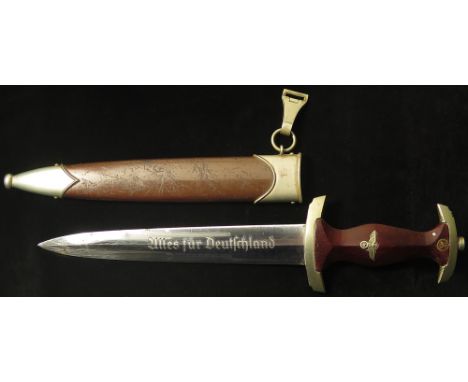 German WW2 SA Dagger with scabbard and metal hanger. Blade maker marked 'GEBR.HELLER', and stamped 'Th' on cross guard