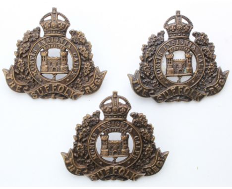 Suffolk's - Officer's bronze hat badge & 2 collars. All have 2 Towers with a King's crown. Hat badge has fold-over lugs. 