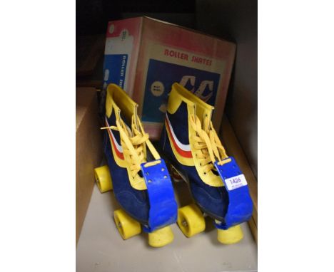 A pair of childrens roller skates size 34
