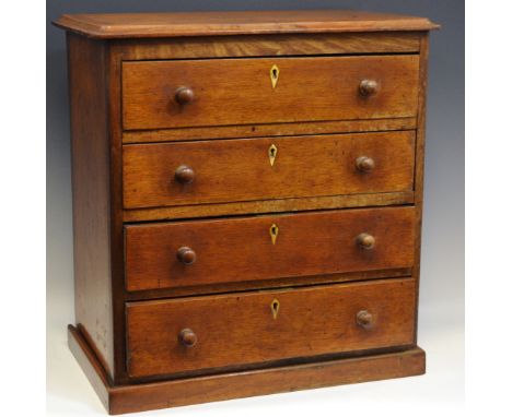Miniature Furniture - a 19th century mahogany diminutive chest of four long graduated drawers, turned handles, kite shaped es