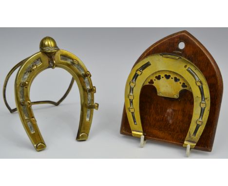 A 19th century brass novelty easel pocket watch and pen stand, as a horseshoe crested by a jockey cap, 13cm high, c.1890; a l