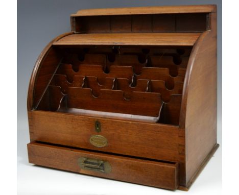 A Saunder's Brothers mahogany tambour fronted stationery cabinet, the interior with waterfall letter racks, pen rest and well