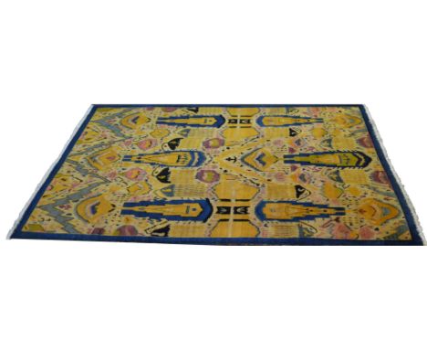 A Charles Voysey style carpet, retailed by Liberty, stylised feathers and geometric pattern in Peacock blue, ochre and black,