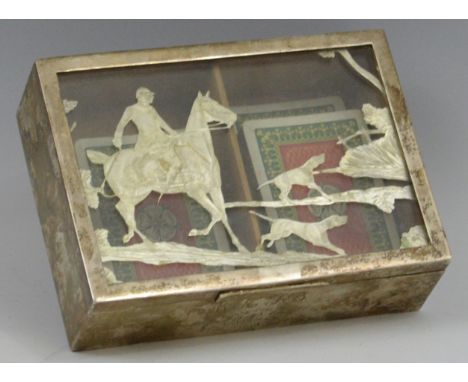 An early 20th century plated rectangular playing card box, the clear glass cover set with huntsman and two hounds, engraved W