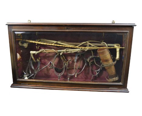 Hunting Lodge - an interesting display, with riding crops, spurs, leather saddle hip flask, boot pulls, in glazed mahogany ca