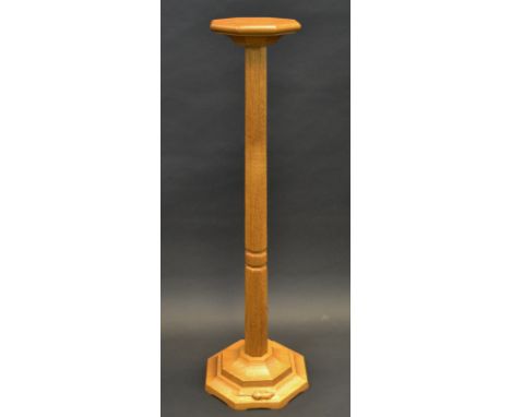 Robert Thompson, Mouseman of Kilburn - an oak  torchere, octagonal top, panelled column, spreading base, 107cm high, 21.5cm w