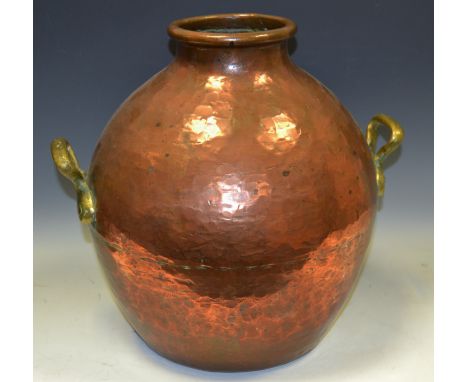 A 19th century Indian two handled copper and brass ovoid water flask, loop handles, 36cm high