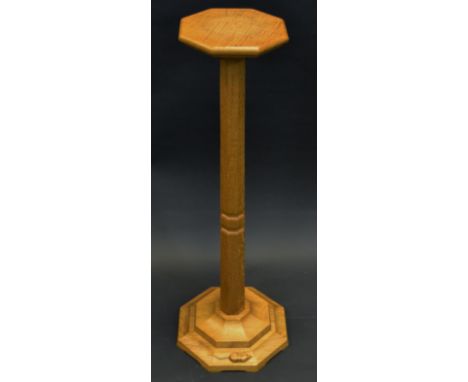 Robert Thompson, Mouseman of Kilburn - an oak  torchere, octagonal top, panelled column, spreading base, 91cm high, 21cm wide