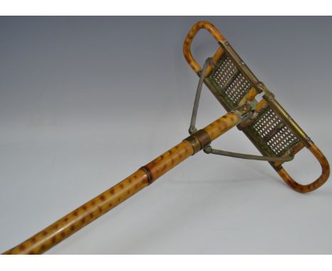 An early 20th century bamboo shooting stick, the caned seat folding for carriage, spiked brass terminal, 89cm long, c.1910