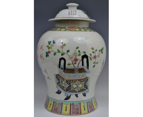 A large Chinese baluster vase and cover, decorated with script, peonies and blossoming prunus in jardinieres,  within trellis