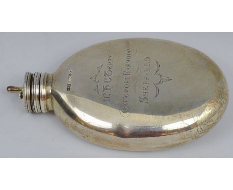 A Victorian silver oval hip flask, screw-off cover, engraved M.H.C. Terry, Oakcroft Ranmoor, 2.5cm high, 4.9oz